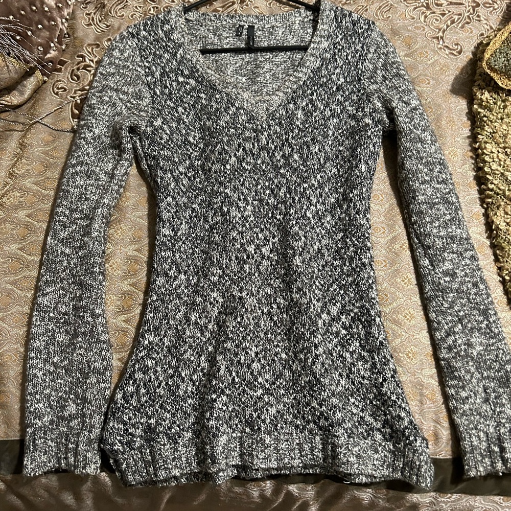 Grey sweater with intertwined sparkly silver